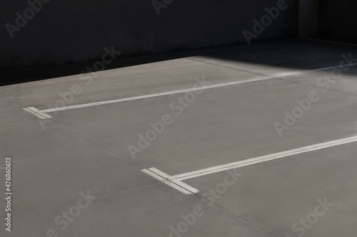Outdoor car parking lot with white marking lines