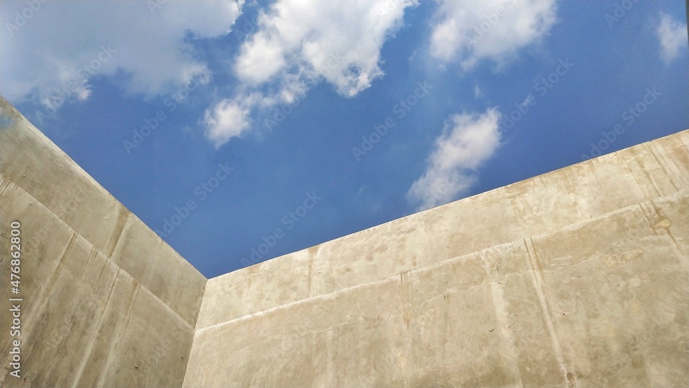 blue sky and concrete wall blue sky and concrete wall