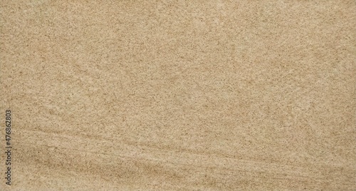 Abstract close-up brown beige sand wall background texture