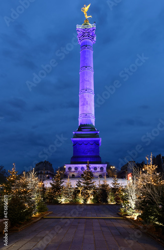 The July Column on Bastille square decorated for Christmas 2021 in the evening , Paris, France.