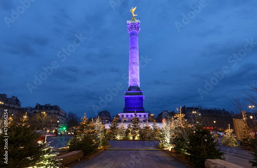 The July Column on Bastille square decorated for Christmas 2021 in the evening , Paris, France.