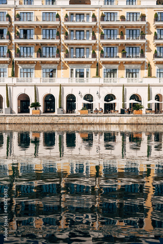 Reflection of the Regent Hotel in the water. Porto, Montenegro