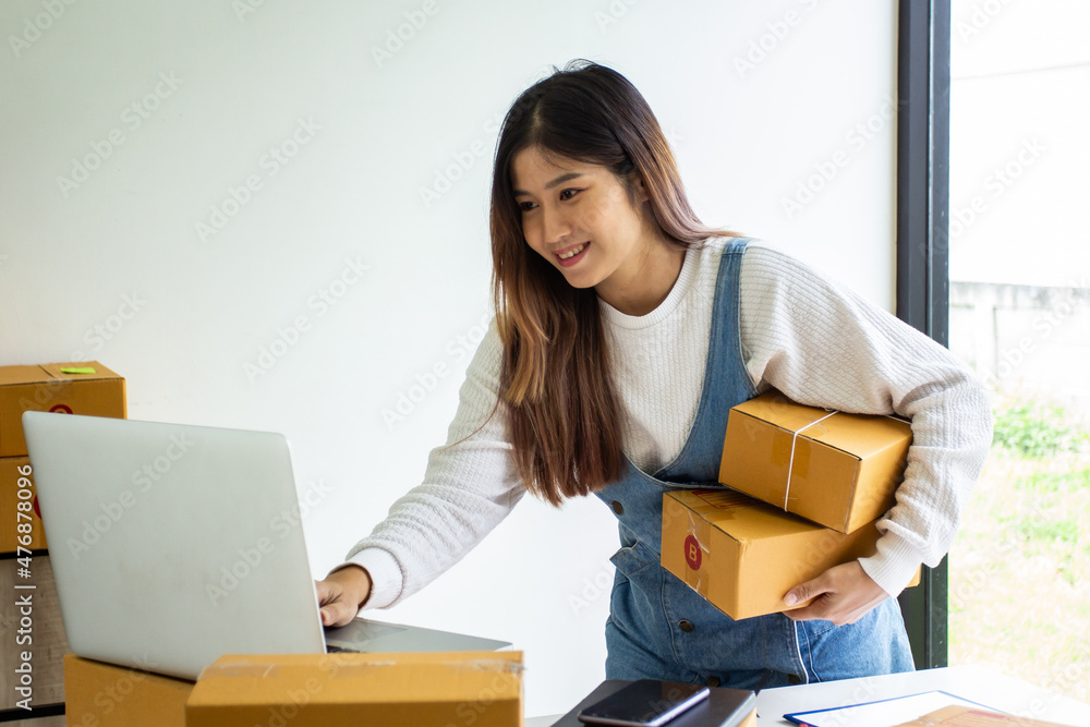 Online business owner checking customer name and address ordering company products, Cropped image of woman checking customer address online for delivery at online sales office. Online business owner checking customer name and address ordering company products, Cropped image of woman checking customer address online for delivery at online sales office.