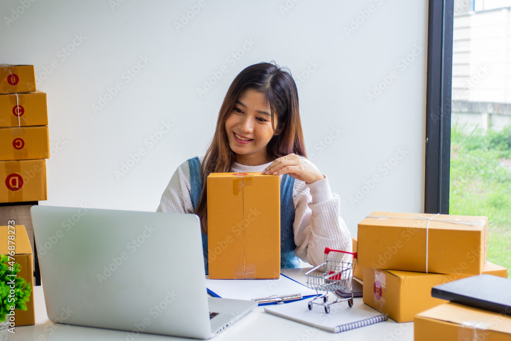 Online business owner checking customer name and address ordering company products, Cropped image of woman checking customer address online for delivery at online sales office. Online business owner checking customer name and address ordering company products, Cropped image of woman checking customer address online for delivery at online sales office.