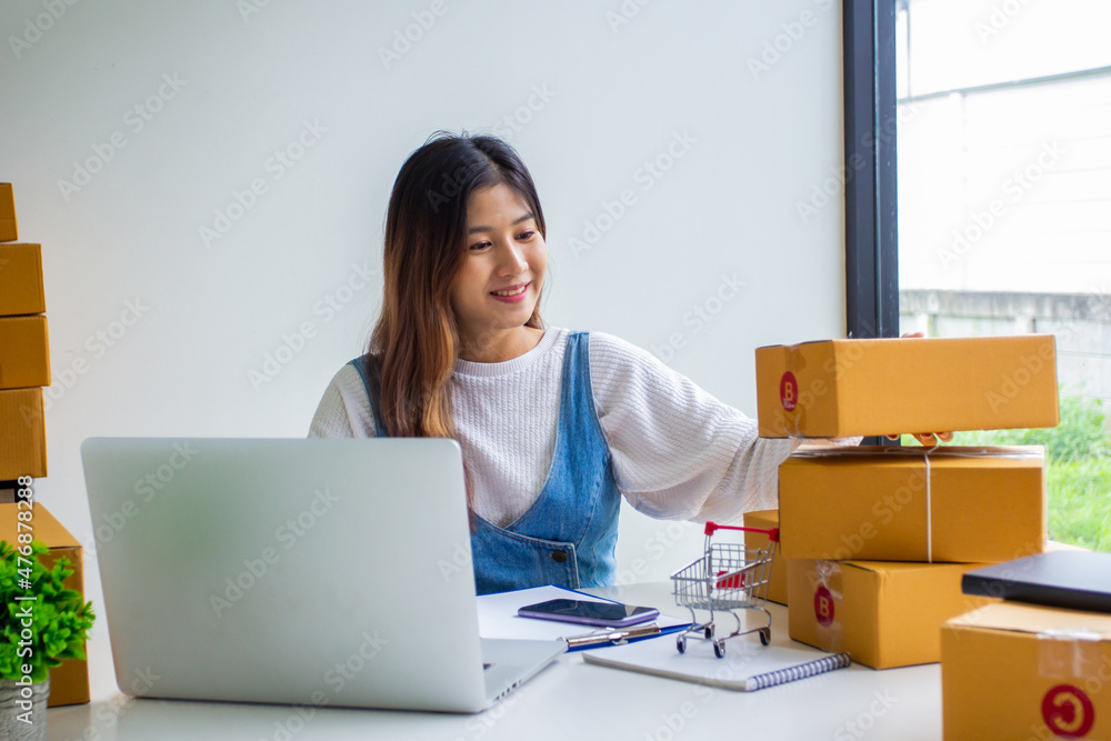 Online business owner checking customer name and address ordering company products, Cropped image of woman checking customer address online for delivery at online sales office. Online business owner checking customer name and address ordering company products, Cropped image of woman checking customer address online for delivery at online sales office.