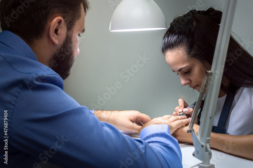 Male manicure process in beauty salon close up