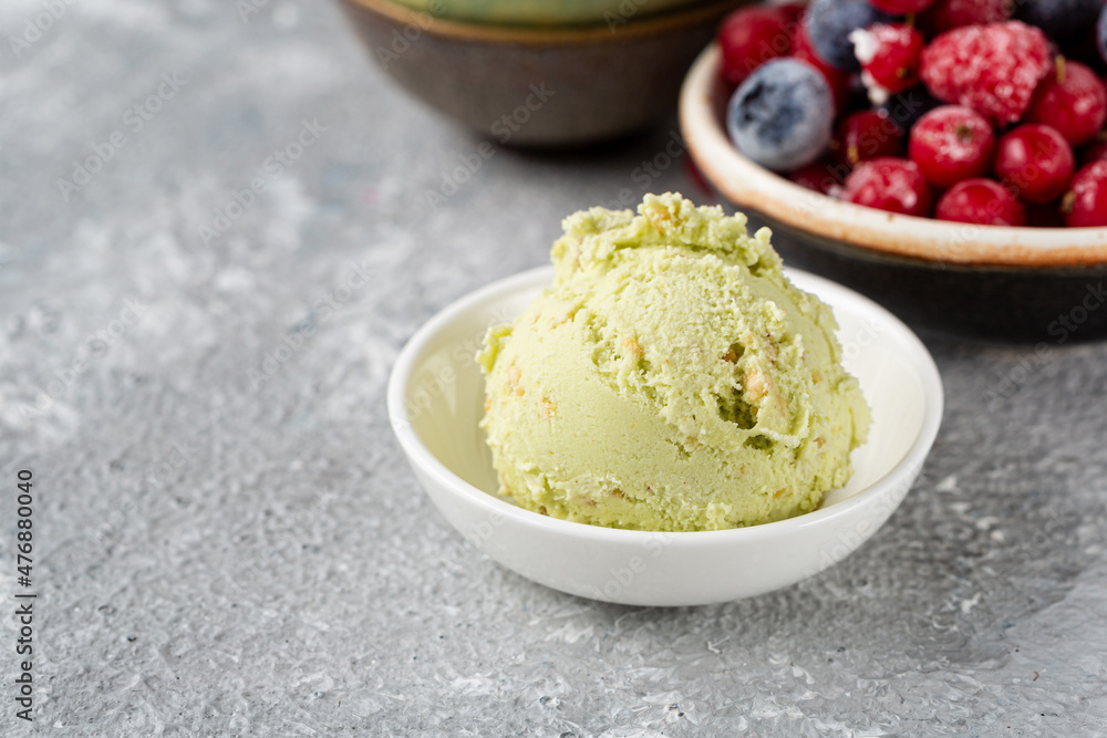 Close up of one scoop pistachio ice cream in bowl Close up of one scoop pistachio ice cream in bowl