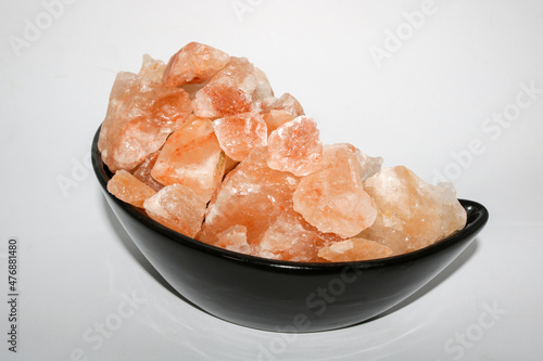 Pink salt on isolated white background.