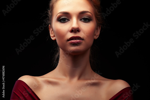 young sensual blond woman posing on black background  lifestyle people concept