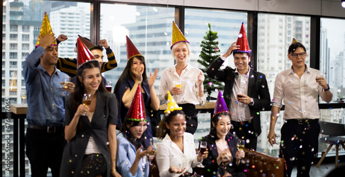 Happiness businesspeople on New Year Party in Office and celebrating of New Year small group.