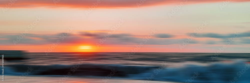 Blurred panoramic sunset sky background. Colorful wide backdrop for design.