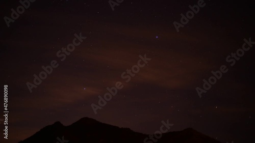 Movement of the night sky in mountain time lapse footage