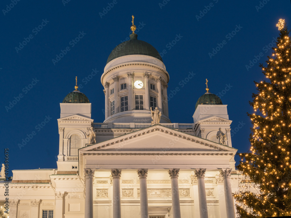 Christmas tree on the background of St. Nicholas Cathedral in Helsinki.