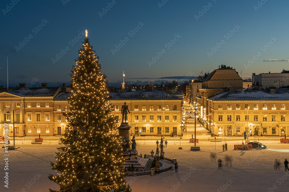 Helsinki. Finland. December 24, 2021 Christmas tree in the background of the Cathedral of St. Nicholas. City center. Christmas holiday.
