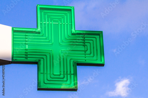 Hasselt, Belgium, March 7, 2021. The green cross is used as a sign for pharmacies in France, Belgium and sometimes in other countries.
