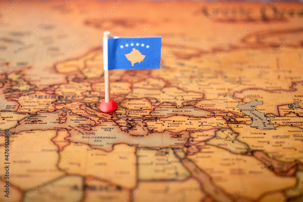 The Flag Of The Republic Of Kosovo On The World Map Stock Photo   1000 F 476902888 EM1YYSoDh4rPqlZomitUcxTsAp33SYWA 