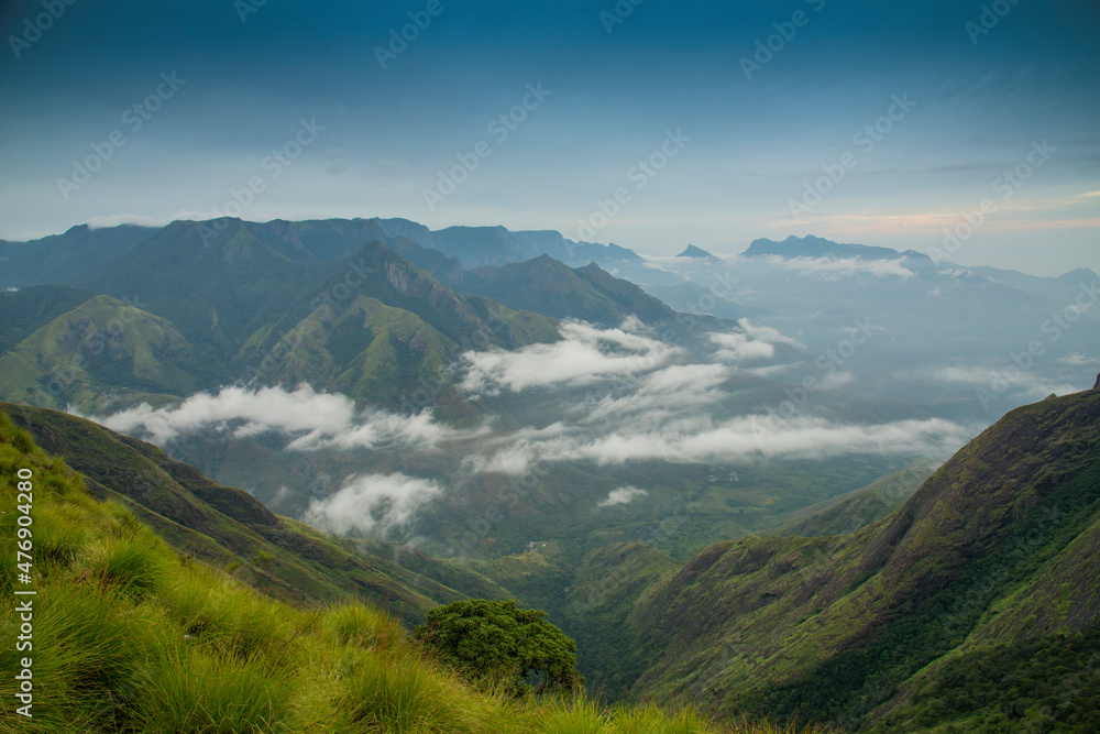 Amazing mountain landscape with clouds, tea estate natural outdoor travel background. Beauty world.