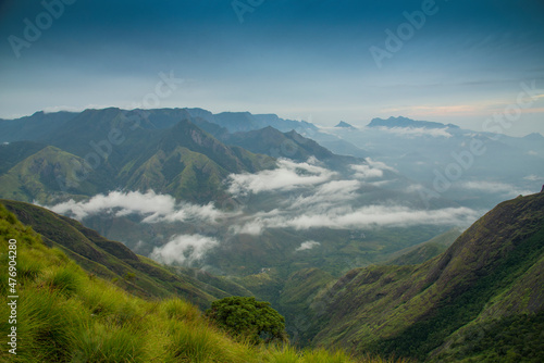 Amazing mountain landscape with clouds, tea estate natural outdoor travel background. Beauty world. © SivaG