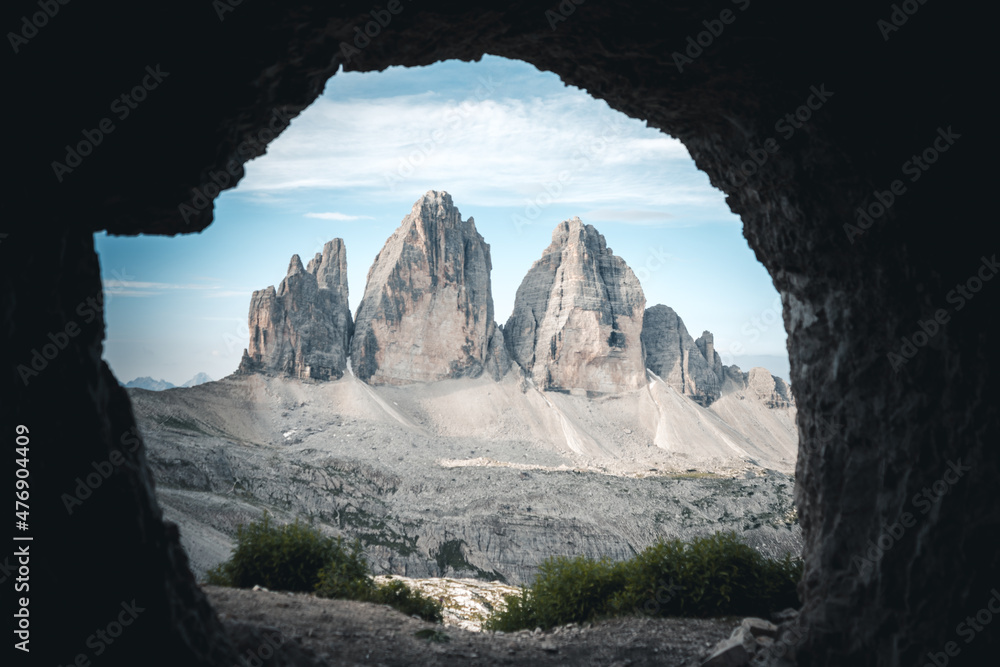 three peaks of lavaredo peaks as seen from inside a cave where soldiers use to sleep during the second or first world war