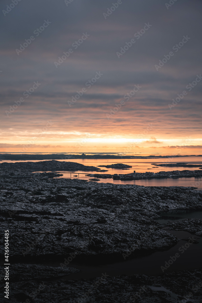 sunset over the sea in the swedish archipelago during winter