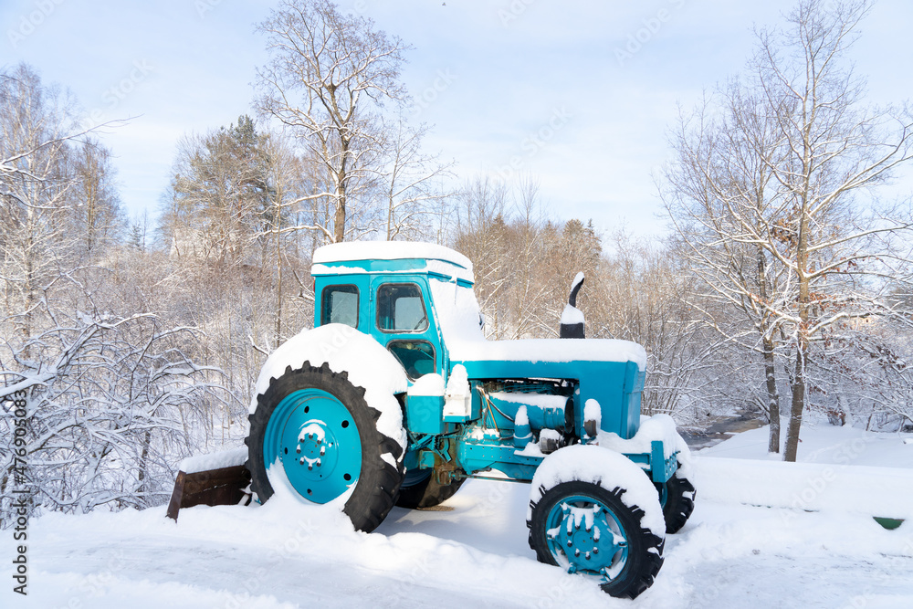 Soviet time tractor on sunny winter day Soviet time tractor on sunny winter day