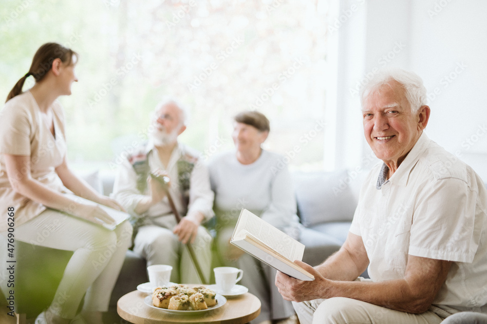 Senior people during afternoon in the nursing home living room Senior people during afternoon in the nursing home living room