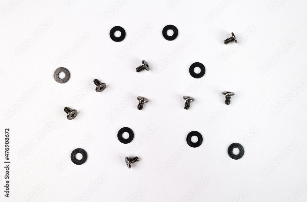 6mm Small Screws with black washer isolated on a White Background. These mounting screws are used to build desktop computers (Top View)