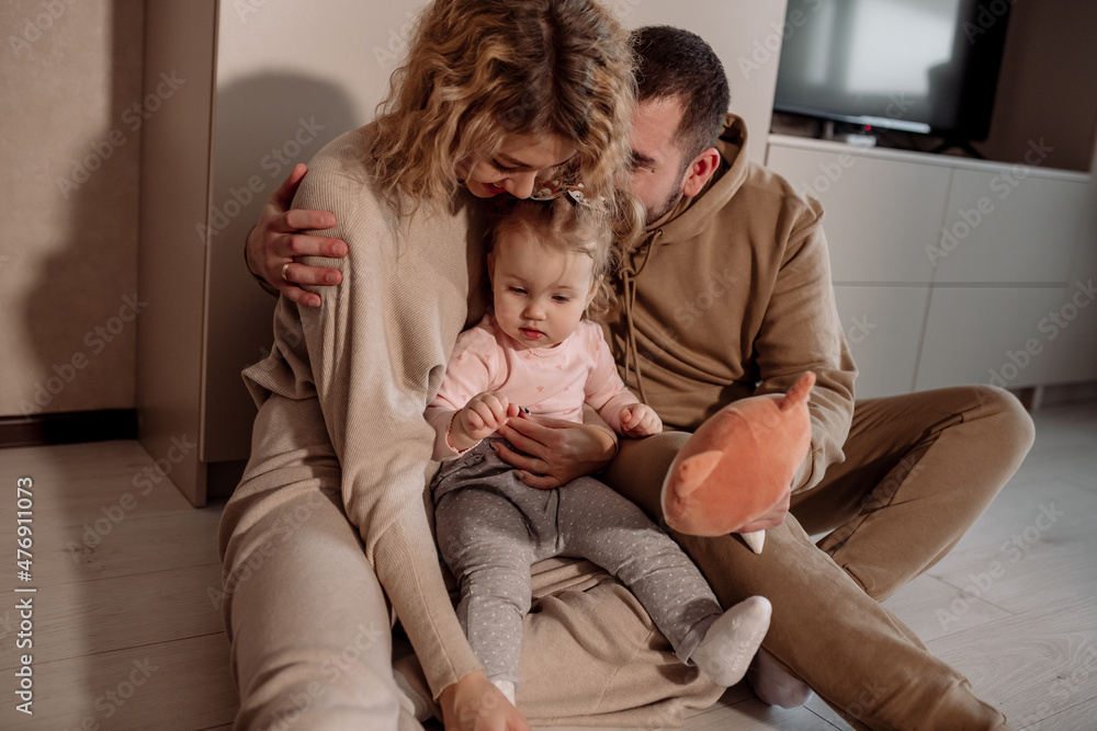 parent and child at home sitting on the floor