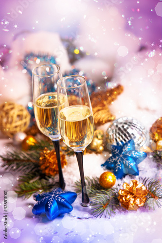 New Year and Christmas Celebration .Two Champagne Glasses in Holiday decoration.