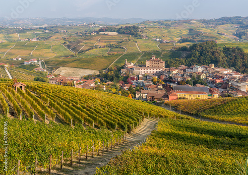Beautiful hills and vineyards during fall season surrounding Barolo village. In the Langhe region, Cuneo, Piedmont, Italy.