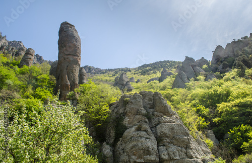 Mountain landscape with stones of the Valley of Ghosts on Demerdji, Crimea, Russia. It is a natural tourist attraction of Crimea. Scenic view of the single rocks in South coast of Crimea in summer.