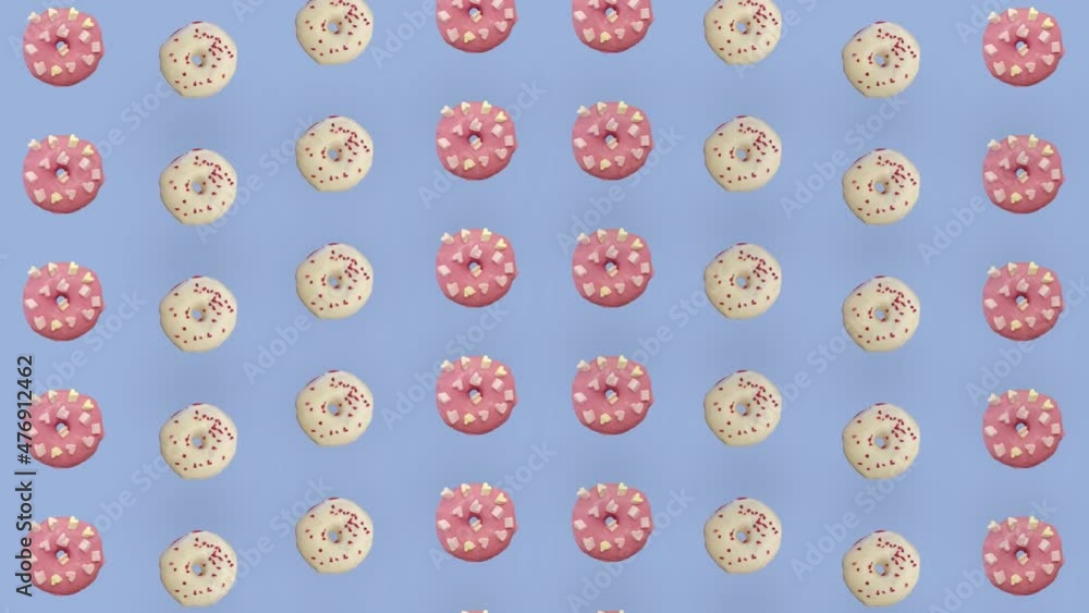Colorful pattern of donuts isolated on purple background. Seamless pattern with donut. Doughnuts. Top view. Realistic animation. 4K video motion Colorful pattern of donuts isolated on purple background. Seamless pattern with donut. Doughnuts. Top view. Realistic animation. 4K video motion