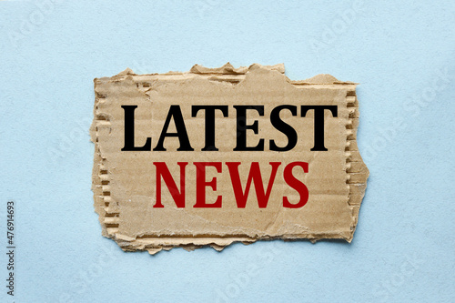 Canvas Print Latest News. text on torn paper on blue background