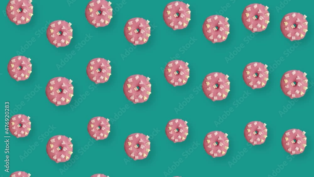 Colorful pattern of pink donuts isolated on green background with shadows. Seamless pattern with donut. Doughnuts. Top view. Realistic animation. 4K video motion Colorful pattern of pink donuts isolated on green background with shadows. Seamless pattern with donut. Doughnuts. Top view. Realistic animation. 4K video motion