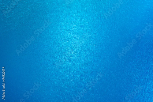 Blue water in the pond texture drone view.