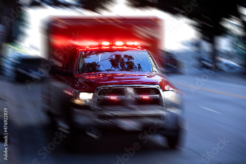Картината върху платно A paramedic ambulance unit rushes to the scene of an incident.
