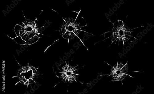 Fotografie, Obraz Collage Hole from a ball in the glass, cracks on a black background