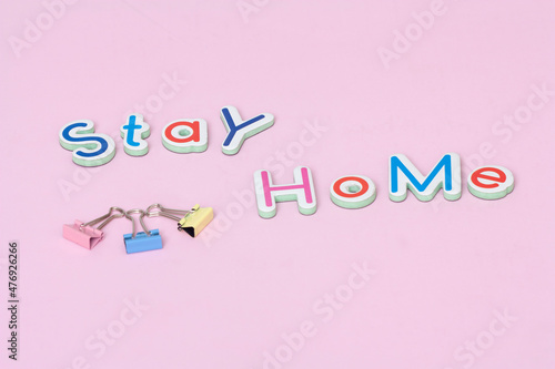 STAY HOME - text on stay home concept  on pink background.