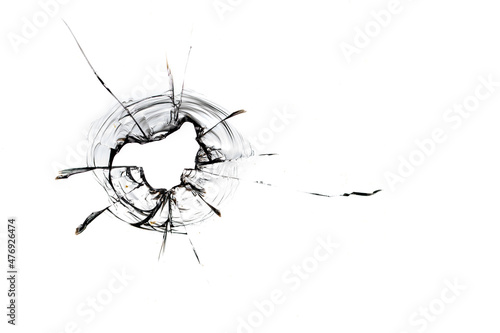 Black cracks from kulsi in glass on a white background. Macro.