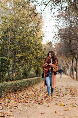 confident mid fashion woman with fall colours in Talavera de la Reina, Toledo, Castilla la mancha