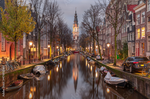 Evening Amsterdam canal Groenburgwal with Zuiderkerk, southern church, Holland, Netherlands.