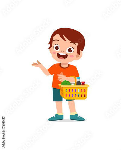 cute little boy carry basket full of groceries