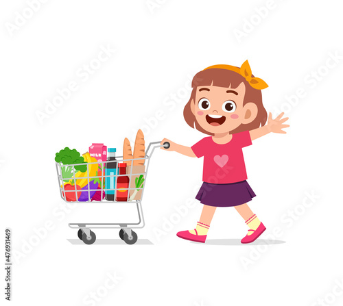 cute little girl push shopping cart full of groceries