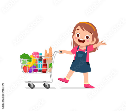cute little girl push shopping cart full of groceries