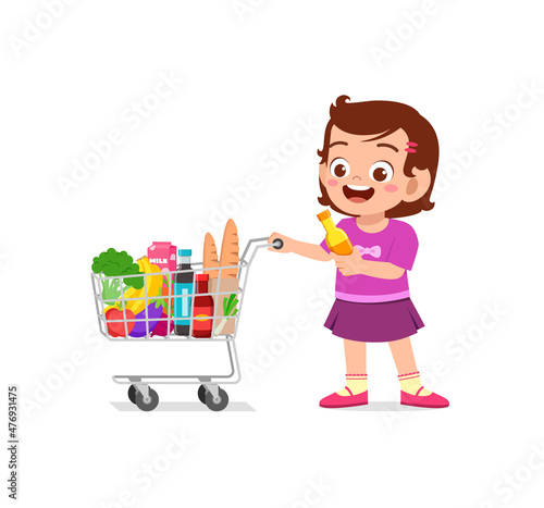 cute little girl push shopping cart full of groceries