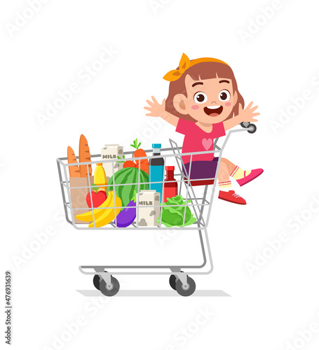 cute little girl sit on shopping cart