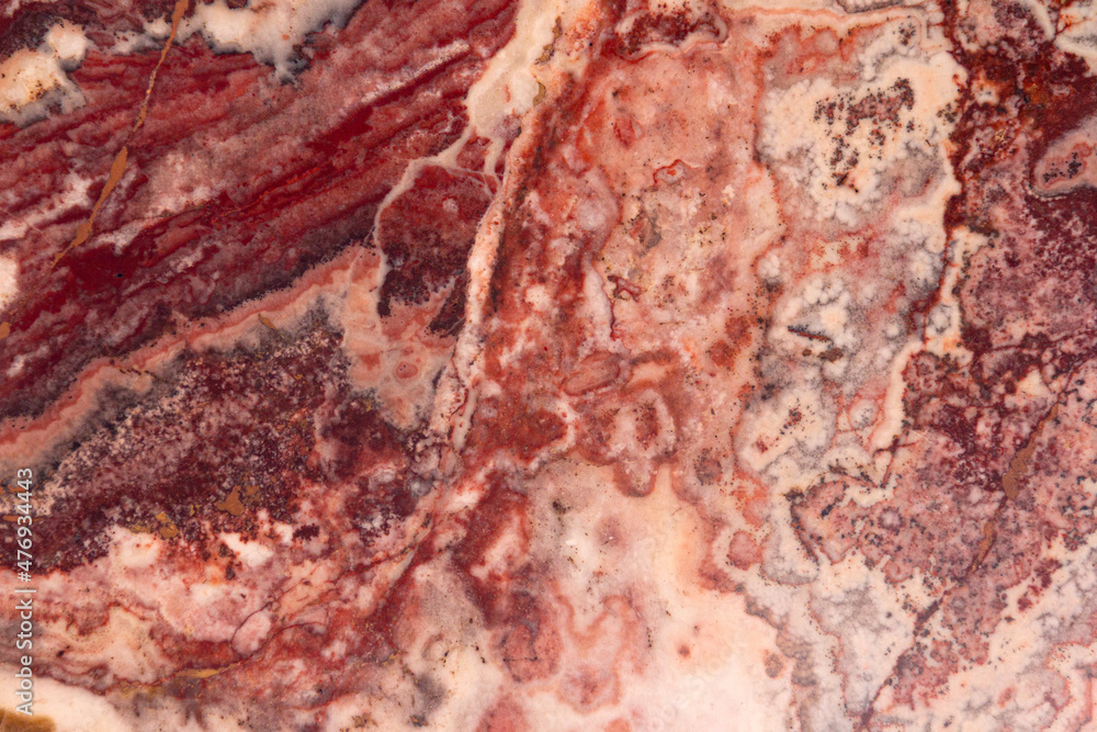 Texture of a stone. Natural marble red color polished, texture background.