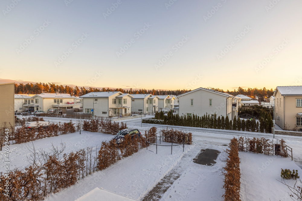 Beautiful landscape view of modern village houses of Sweden on a winter sunny day.