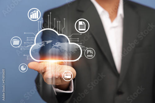Close up of businessman hand pointing at cloud computing and with various icons.