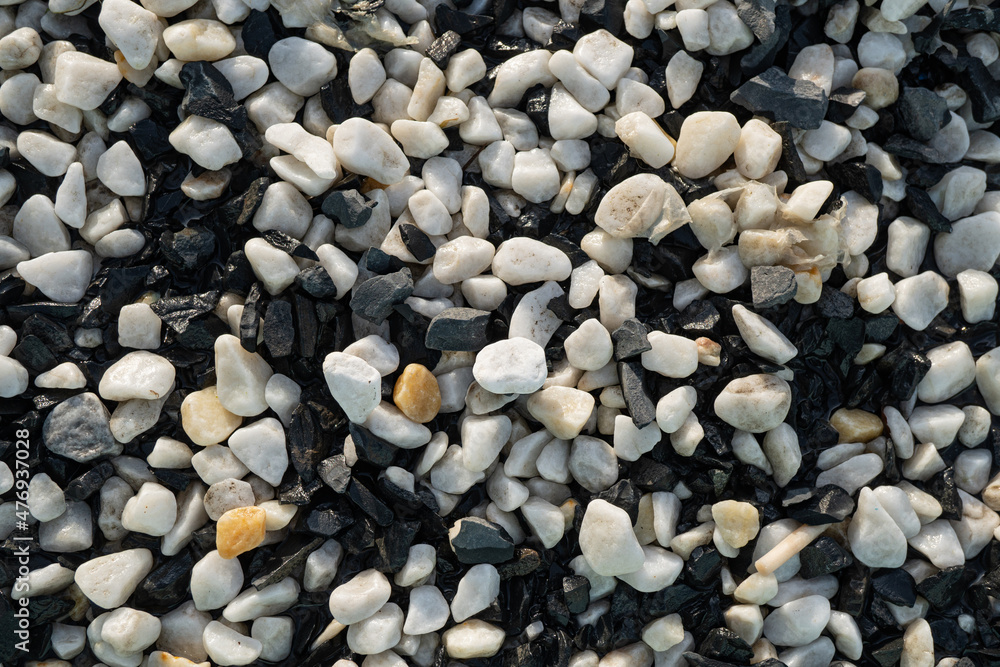 Background image of small black and white round pebbles Background image of small black and white round pebbles